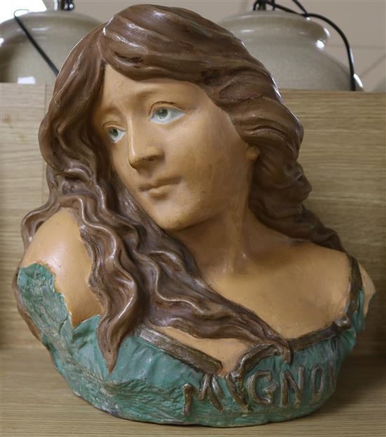 An early 20th century French terracotta bust of a woman, entitled Mignon, 34cm